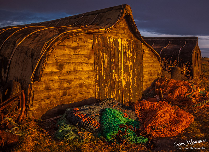 Upturned herring boat huts on Lindisfarne (Holy Island). Landscape photography by Gary Waidson.