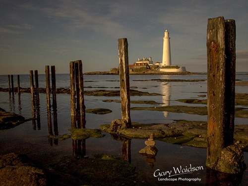 St. Mary's Island Lighthouse, posts and small stack. Landscape photography by Gary Waidson. St. Mary's Island Lighthouse, posts and small stack. Landscape photography by Gary Waidson.